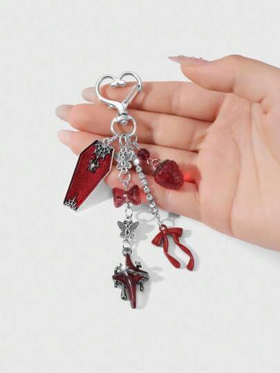Kawaii 1 pièce Porte-clés/Charm de sac au style gothique sucré rétro Y2K unique avec chaîne en cristal, fraise en résine rouge, nœud papillon, papillon, croix, goutte d'huile, araignée. Convient pour les femmes, port quotidien, cadeau de vacances