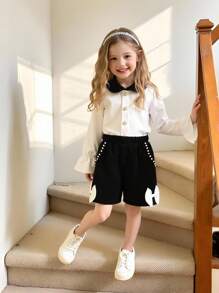 Elladie kids 2件套小女孩彼得潘领彩色衬衫和短裤，带蝴蝶结装饰 - 黑色 - 查看 1