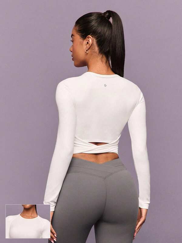 GLOWMODE FeatherFit™ Camiseta de manga larga con cuello redondo, espalda retorcida, agujeros para los pulgares y sujetador incorporado. Ideal para yoga, pilates, barre y uso diario casual de bajo impacto.