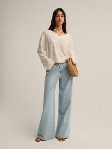 Nöista 长袖针织衫，方形廓形，独特的挂脖式肩带设计，打造轻松别致的造型，是女性冬季的完美之选；易于日常穿着，适合休闲季节装扮、节日圣诞节和现代新年装束。 - 米色 - 查看 4