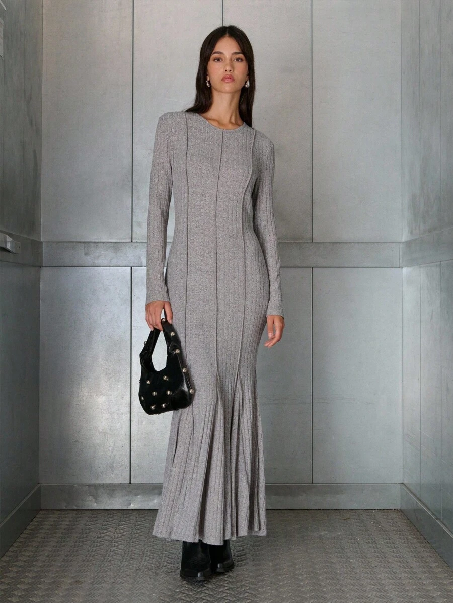 Nöista Nöista Grey Ribbed Knit Maxi Dress With Long Sleeves, Fitted Body, And Flared Hem Detail For A Modern Touch. Perfect For Elevating A Casual Look, Ideal For Cooler Days, And Comfortable For Everyday Wear.