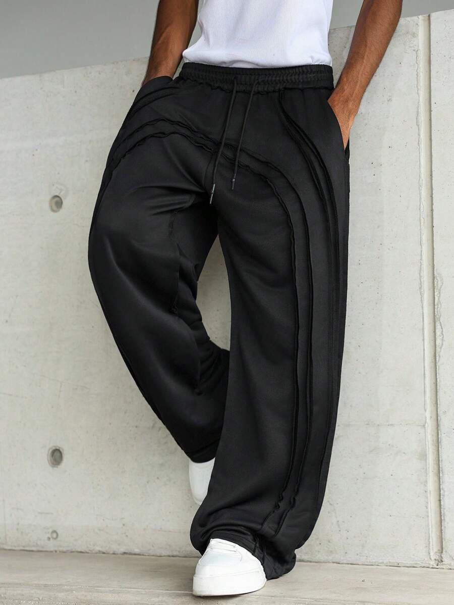 PAVTROS 男士年轻街头风格做旧开放式双层毛边拱形结构宽松阔腿运动裤，松紧腰针织运动裤带有微妙的做旧细节，休闲街头风格，适合日常休闲时尚穿着，适合作为节日礼物黑色运动裤黑色慢跑裤男士黑色裤子宽松运动裤男士黑色宽松运动裤男士阔腿裤男士宽松裤男士运动裤男士运动裤宽松运动裤男士 - 黑色 - 查看 1