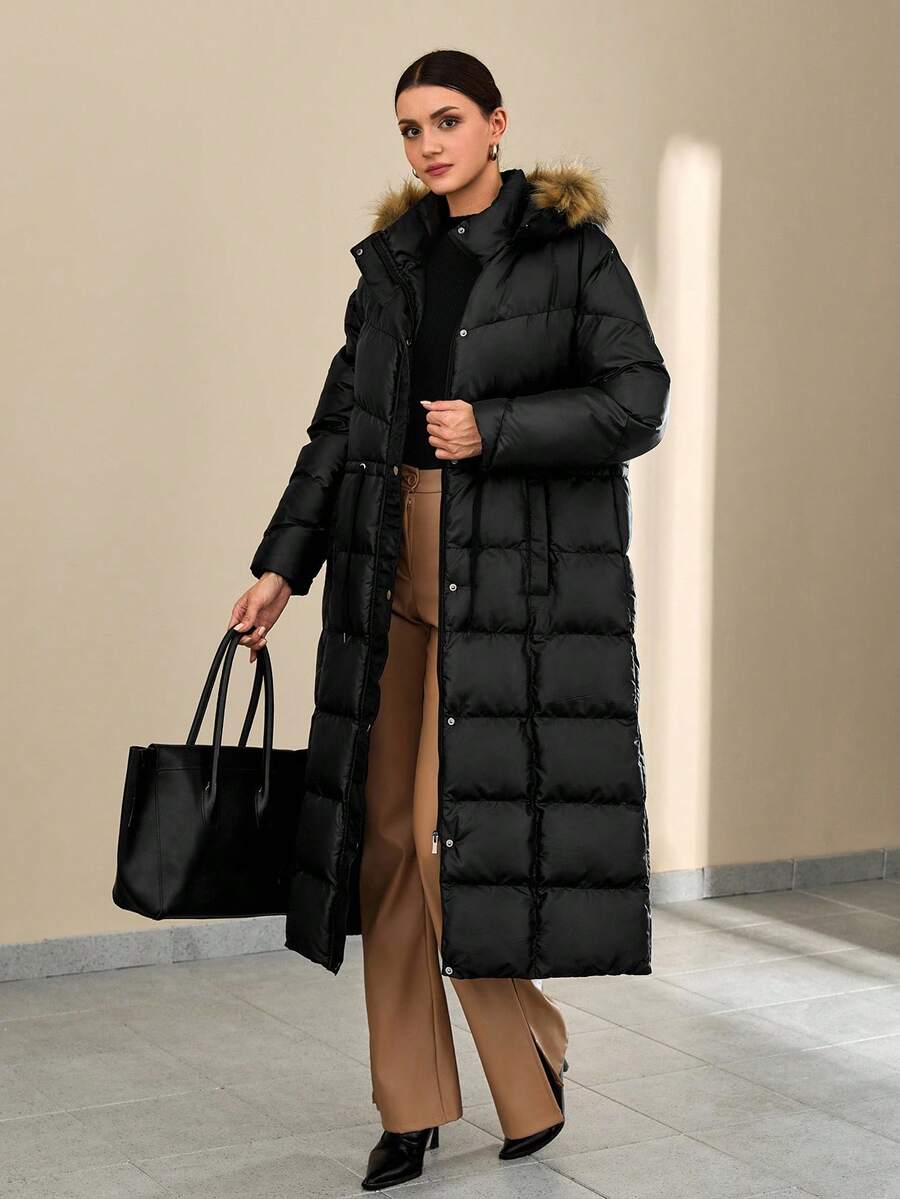 Cappotto imbottito lungo nero con vita regolabile con coulisse e bordo in pelliccia sintetica sulla cappuccio - Essenziale invernale per uno stile di strada confortevole. - nero - Visualizzare 1