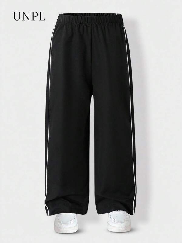 SHEIN Pantalones negros con ribete a rayas para niñas, estilo deportivo casual, adecuados para salidas casuales diarias, escuela, primavera, verano, otoño, regreso a la escuela 2025 Conjunto de ropa escolar y deportiva para niñas jóvenes