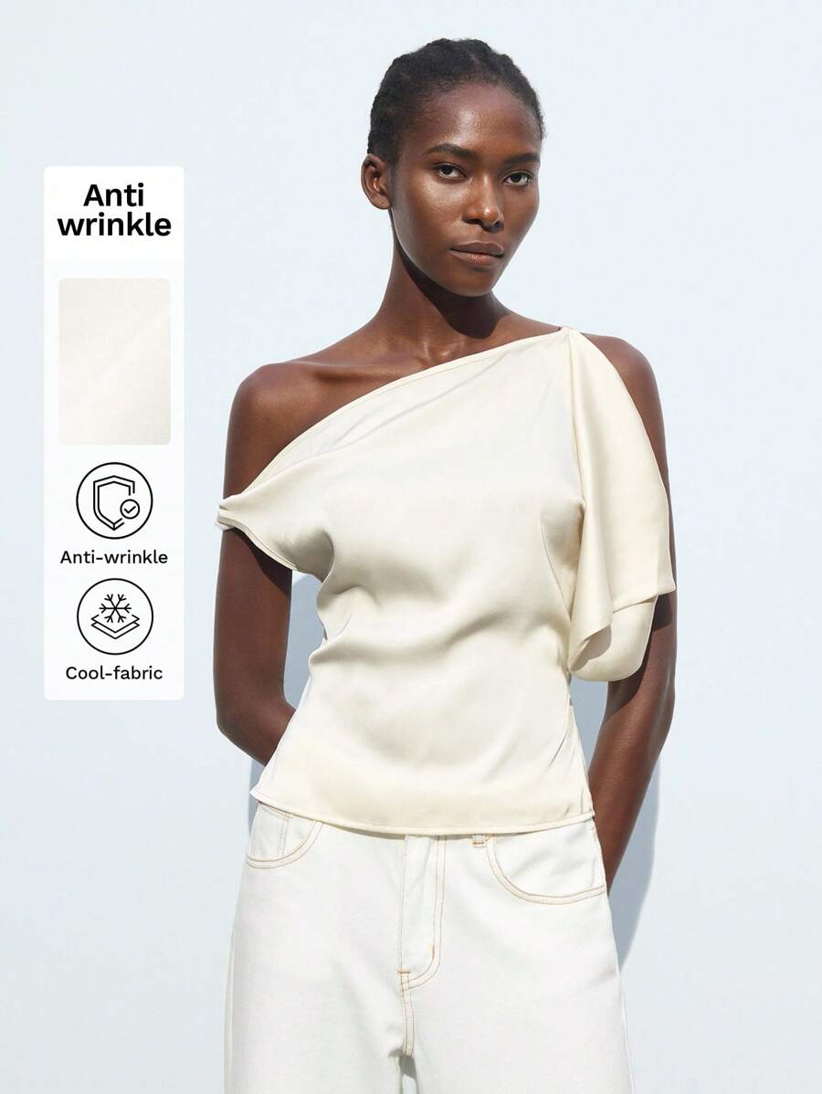 Maija 一件白色不对称领口女式上衣,百搭、优雅、时尚都市风,舒适休闲,适合商务或休闲场合,如音乐会、社交活动、办公室穿着、邮轮度假、优雅海滩、波西米亚风度假装,四季皆宜,明星同款度假风,异域风情,乡村音乐会、西部风情,高档面料,舒适透气,现代都市休闲时尚,商务休闲女装,低调复古风,派对上衣,海滩夏季假期,每个假期都适合穿着 - 白色 - 查看 1