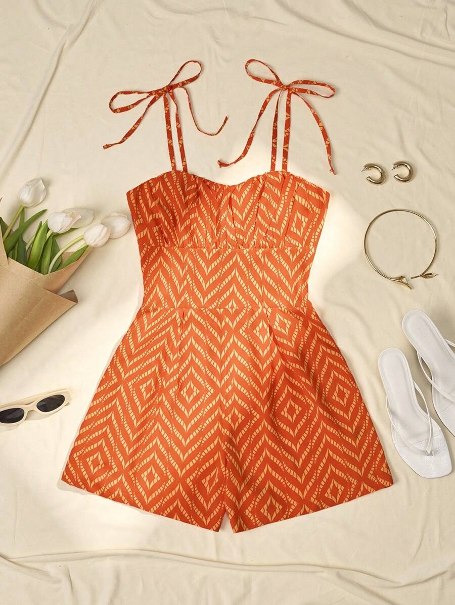 Bộ đồ liền thân in họa tiết buộc vai nhún bèo ngực - Nhiều màu - Xem 1