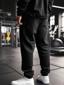Gym Rark 男士纯黑色长款运动裤，采用柔软针织面料，带有荧光效果，宽松舒适，适合健身穿着，也适合慢跑、运动等场合，亦可作为万圣节或哥特风格的运动服。 - 黑色 - 查看 2