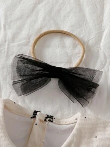 Souflis Souflis 女婴荷叶边领长袖A字裙，搭配薄纱蝴蝶结头饰。超大领口、泡泡袖和A字廓形，打造时尚经典造型。无论是外出还是居家休闲，小公主都能成为众人瞩目的焦点。 - 彩色 - 查看 6