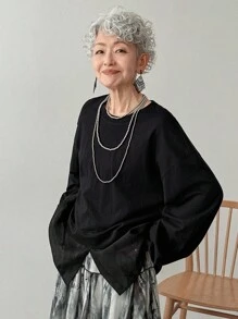 FRIFUL Women's Black Solid Color Round Neck Drop Shoulder Long Sleeve Patchwork Sheer Fabric Loose Casual Versatile Sweatshirt, Autumn/Winter