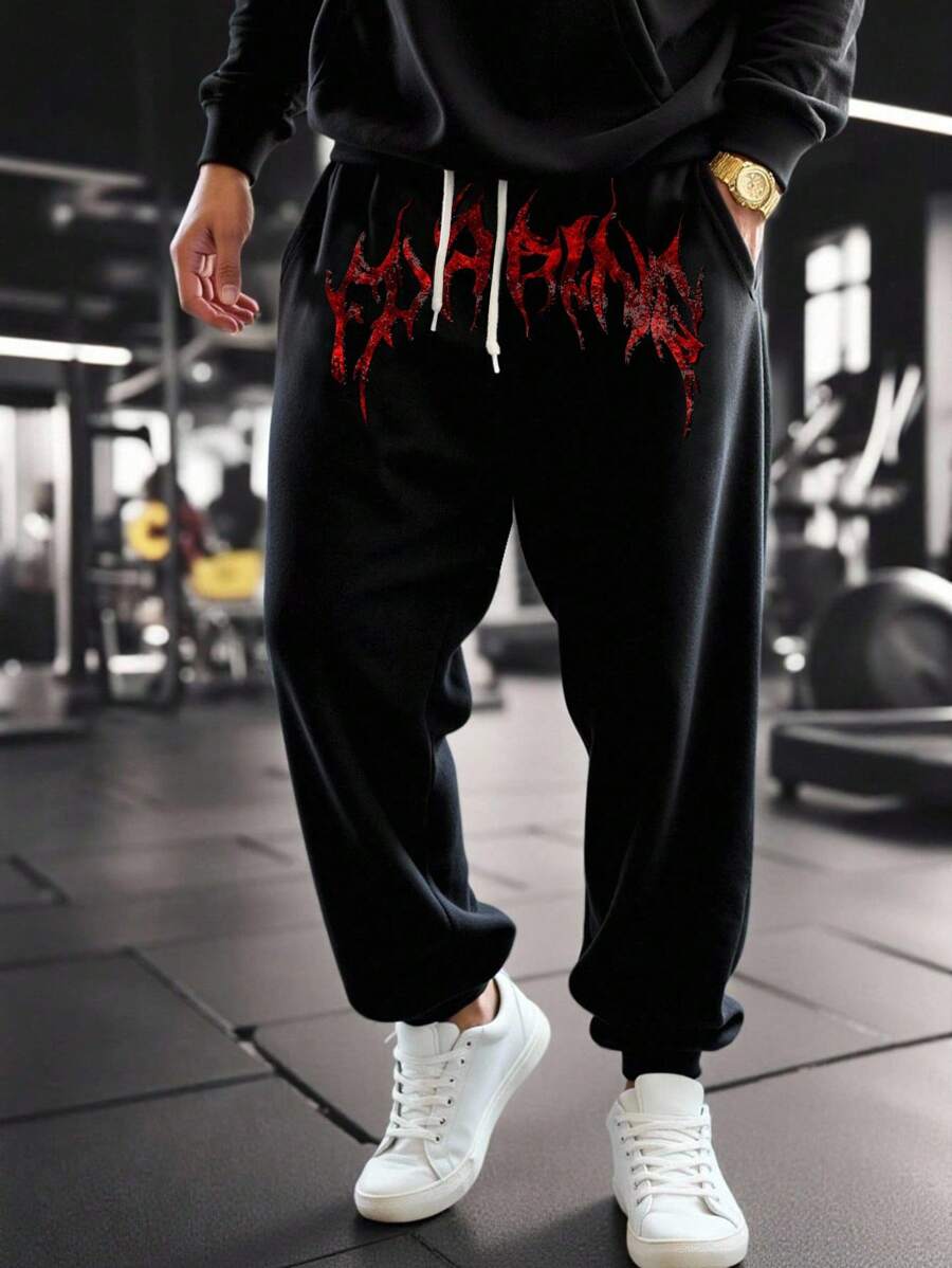 Gym Rark 男士纯黑色长款运动裤,采用柔软针织面料,带有荧光效果,宽松舒适,适合健身穿着,也适合慢跑、运动等场合,亦可作为万圣节或哥特风格的运动服。 - 黑色 - 查看 1