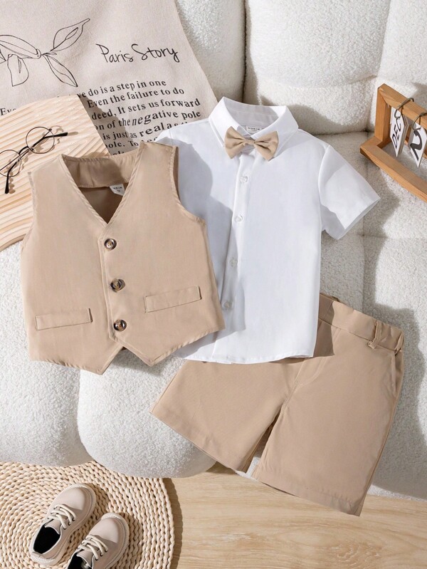 Souflis Souflis 3pcs Young Boy Gentleman Outfit Set, Includes Bow Tie, White Collared Shirt, Vest And Casual Shorts, Fashionable Gentleman Suit For Daily Casual Wear, Birthday Party, Wedding, Halloween, Christmas, Thanksgiving Celebration, Formal Attire, Performance, Spring/Summer Back To School Season