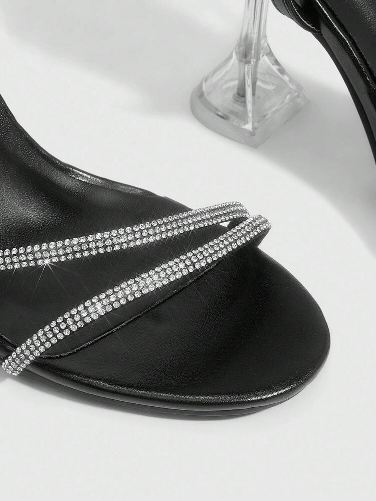 CUCCOO SZL Sandales à talons hauts femme avec bride à la cheville, bout rond, talon en verre, style sexy et avec nœud papillon en métal argenté