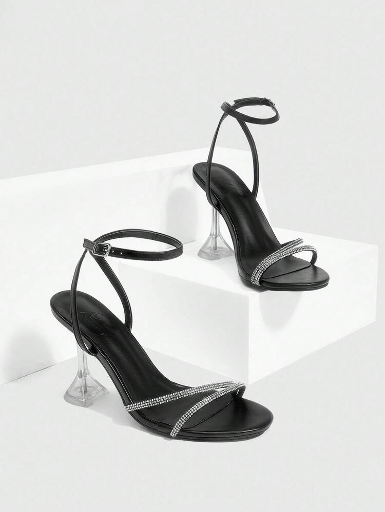 CUCCOO SZL Sandales à talons hauts femme avec bride à la cheville, bout rond, talon en verre, style sexy et avec nœud papillon en métal argenté