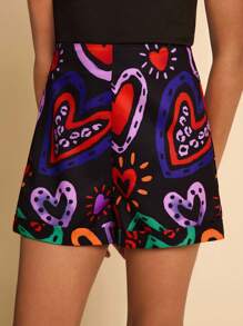 SHEIN Pantalones cortos tejidos con estampado de corazón para niña preadolescente