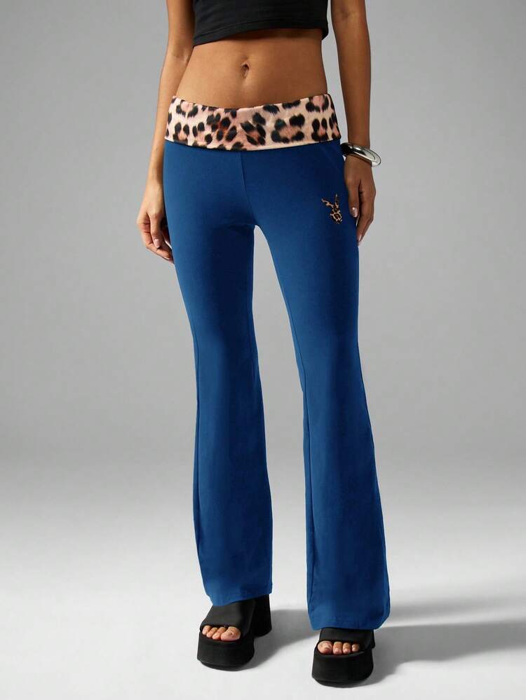 Missguided x Playboy Leggings a zampa di elefante da donna in stile Y2K con stampa leopardata, vita arrotolata, stile retrò, bootcut, adatti per feste, club, festival