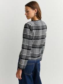 Nöista Chaqueta a cuadros en blanco y negro con mangas largas y botones grandes, ideal para el otoño o estilos de negocios casuales atemporales en invierno.