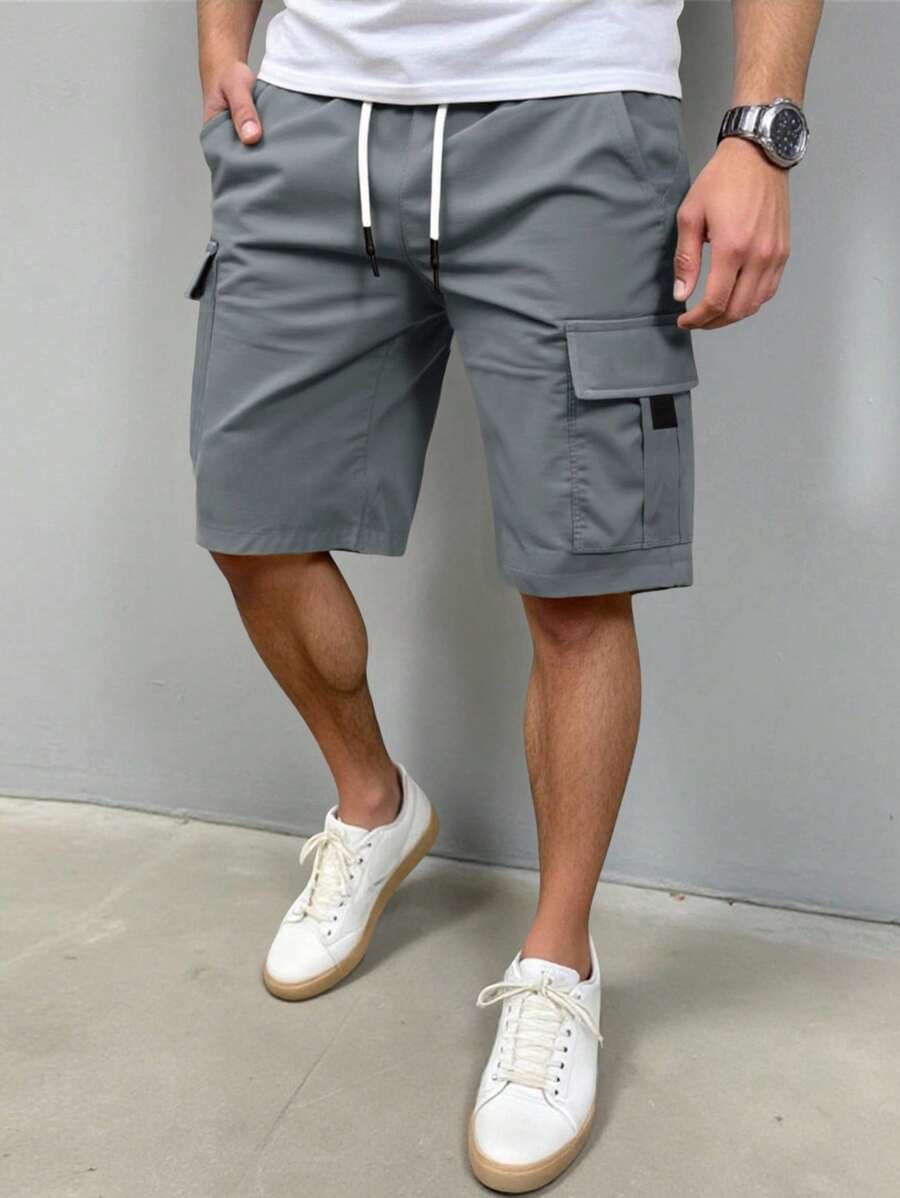Manfinity Homme Pantaloni scurți cargo pentru bărbați, culoare solidă, talie elastică, cu șnur, buzunare, pantaloni scurți cargo gri, pantaloni scurți cargo pentru bărbați, pantaloni scurți gri, pantaloni scurți cu buzunare - Gri inchis - Vizualizare 1