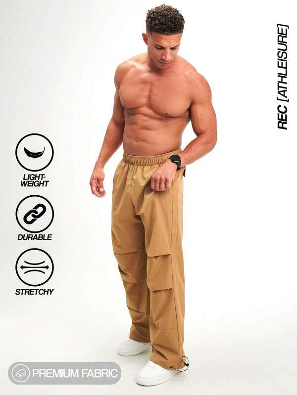 بنطلون رجالي بخصر مطاطي وتجاعيد ساق واسعة وفضفاضة، بني