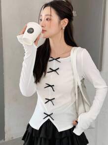 SHEIN Áo thun dài tay cổ tròn màu trơn cho nữ tuổi teen, tay raglan, phối nơ tương phản, kiểu dáng thường ngày, thích hợp cho kỳ nghỉ, mùa xuân/hè, năm mới/trở lại trường/ngày đầu tiên đi học. - trắng - Xem 7