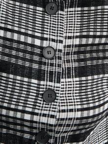 Nöista Chaqueta a cuadros en blanco y negro con mangas largas y botones grandes, ideal para el otoño o estilos de negocios casuales atemporales en invierno.