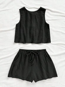 Soleia Áo ba lỗ dáng chữ A, hở lưng, chất liệu vải kết cấu, dáng rộng thoải mái, có dây rút ở eo, quần short phù hợp cho đi biển, bộ đồ mùa hè 2 món cho nữ, trang phục mùa hè 2 món, bộ quần short 2 món cho nữ, bộ đồ 2 mảnh màu đen, bộ đồ ngắn 2 món cho nữ - màu đen - Xem 4