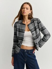 Nöista Chaqueta a cuadros en blanco y negro con mangas largas y botones grandes, ideal para el otoño o estilos de negocios casuales atemporales en invierno.
