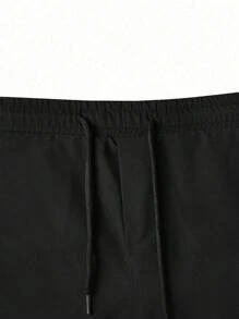 Manfinity Homme Pantalones cargo con bolsillo con solapa y cintura con cordón, otoño - Negro - Ver 5
