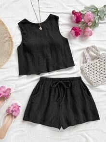 Soleia Áo ba lỗ dáng chữ A, hở lưng, chất liệu vải kết cấu, dáng rộng thoải mái, có dây rút ở eo, quần short phù hợp cho đi biển, bộ đồ mùa hè 2 món cho nữ, trang phục mùa hè 2 món, bộ quần short 2 món cho nữ, bộ đồ 2 mảnh màu đen, bộ đồ ngắn 2 món cho nữ - màu đen - Xem 6