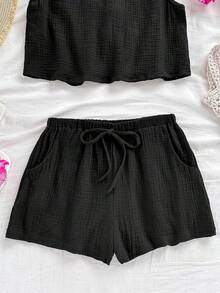 Soleia Áo ba lỗ dáng chữ A, hở lưng, chất liệu vải kết cấu, dáng rộng thoải mái, có dây rút ở eo, quần short phù hợp cho đi biển, bộ đồ mùa hè 2 món cho nữ, trang phục mùa hè 2 món, bộ quần short 2 món cho nữ, bộ đồ 2 mảnh màu đen, bộ đồ ngắn 2 món cho nữ - màu đen - Xem 3