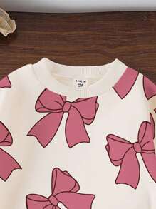 SHEIN Bộ đồ 2 món cho bé gái, gồm áo nỉ dài tay cổ tròn in nơ và quần nỉ, màu hồng, thích hợp cho mùa thu/đông. - Nhiều màu - Xem 6