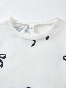 SHEIN Sparklyn Bộ đồ nỉ cho bé gái tuổi teen, Thu/Đông mới, In kỹ thuật số màu trắng, Áo nỉ cổ tròn nơ đen, Quần bó màu đen, Trang trí nơ trắng, Vừa vặn thoải mái cho mùa thu - Nhiều màu - Xem 7