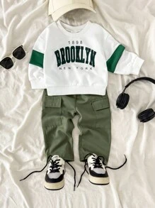 SHEIN Playful Pals 2pcs/Set Infant Baby Boy White Knit Sweatshirt With Green Color Block & Letter Print Long Sleeve Top & Military Green Elastic Waist Pocket Woven Pants, Fits 6 Months To 2-3 Years Old Baby Boy Brooklyn Outfit Baby Boy Casual Outfit Baby Boy Outfit Set Baby Boy Clothes Baby Boy Cargo Pants Set Baby Boys Outfit Baby Boy Sweatsuit, Outfit, Infant Qutfits, Tracksuits, Infant Boy Winter Clothes Set, Baby Boy Cargo Pants Baby Boy Sweatshirt Outfit Boys Green Pants Fall - Multicolor - View 4