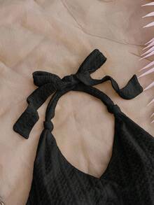 SHEIN Teen Girls Vacation Black Knitted Crinkled Fabric Halter Neck Bow Jumpsuit, Snug Fit & Suitable For Party, Valentine's Day, Wear As Innerwear Or Outerwear Black Halter Dress Black Romper Black Playsuit Textured Mini Playsuit - Black - View 3