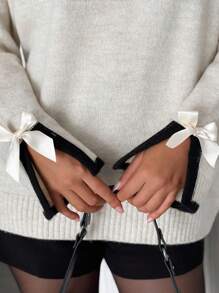 EURMUSE Beige stickad tröja med svarta ribbade kanter och band i ärmarna - Grädde - Visa 1