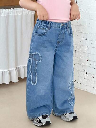 SHEIN 女童Y2K蝴蝶结贴片宽松蓝色牛仔长裤，舒适、可爱、休闲时尚，适合度假和返校穿着。