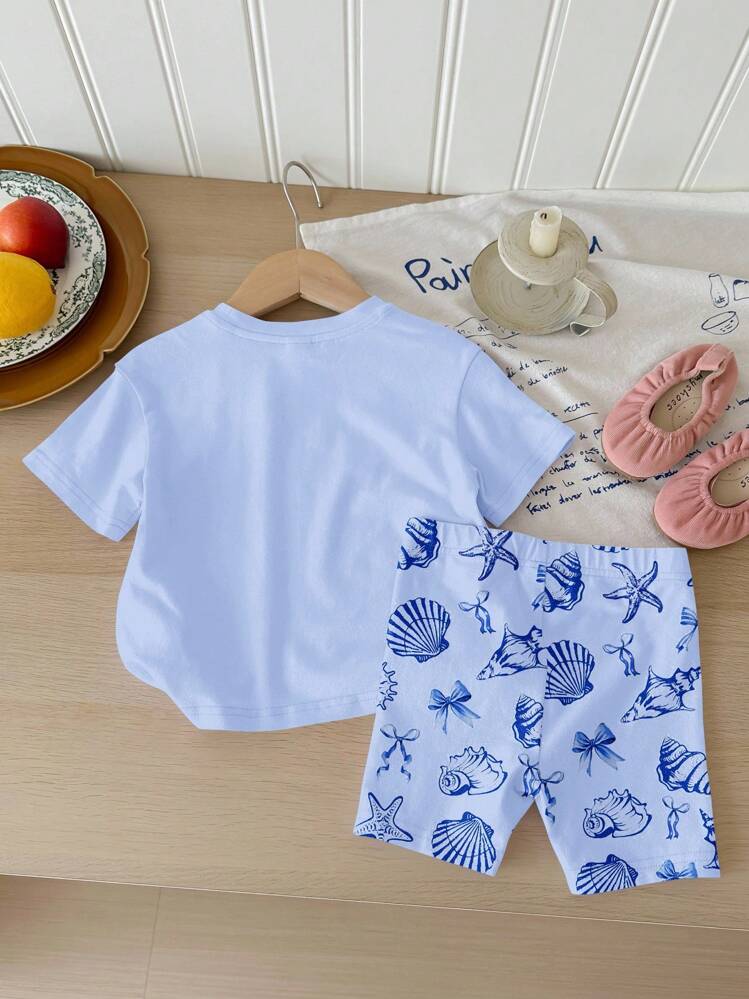 SHEIN Bộ đồ thể thao cho bé gái gồm áo thun tay ngắn cổ tròn dáng rộng và quần short bó sát in hình sinh vật biển dễ thương, vỏ sò và nơ, thích hợp cho mùa xuân/hè. - Nhiều màu - Xem 3