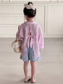 SHEIN Young Girl Woven Bow Striped Shirt With Criss-Cross Back Design, Casual, Korean Style, Suitable For Spring, Summer, Autumn, Winter Girls Open Back Shirt Girls Pink Bow Shirt Girls Tie Back Shirt Girls Fall Outfits Long Sleeve Pink Striped Blouse With Drop Shoulder And Stylish Back Bow Accent  Girls Pink Shirt - Pink - View 2