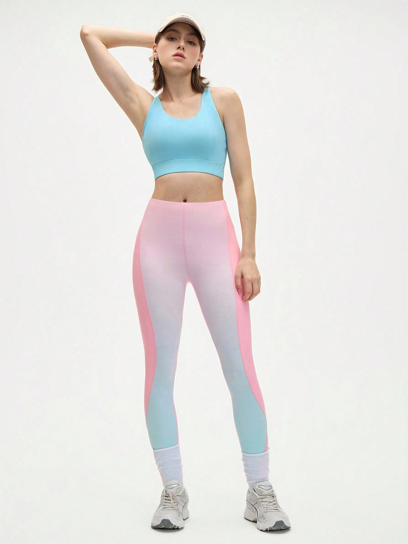 A women's sports suit consisting of an open-back j...