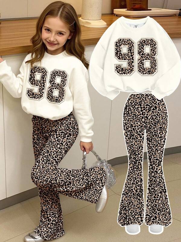 SHEIN Leap Crew Crema blanco, estampado de leopardo retro 98, gráfico deportivo universitario, conjunto de 2 piezas de sudadera de cuello redondo holgada y pantalones acampanados para niñas preadolescentes, atuendos de otoño para comodidad fácil, capas de otoño para niños, ropa gráfica casual, ropa de vuelta al colegio, ropa de otoño, homecoming, adecuado para picnic al aire libre, fotografía callejera, hogar, campus, relajado
