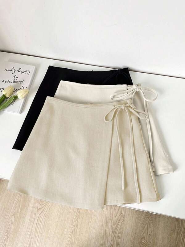 Franclia Falda corta de tela ancha con textura de estilo caqui, nueva de verano, versátil y casual con tirantes y bajo asimétrico, ropa de mujer para graduación, ropa de verano, prendas de vestir de mujer para el verano