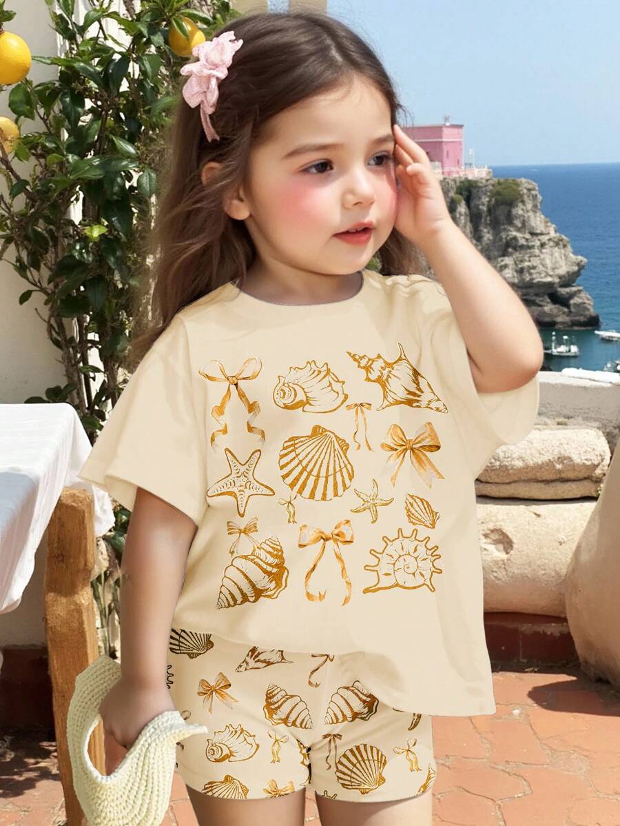 SHEIN 可爱海洋生物、贝壳、蝴蝶结印花女婴休闲宽松圆领短袖T恤和修身骑行短裤套装，适合春夏季节、休闲度假、海滩周末、可爱夏季服装、女婴夏季单品、韩版风格、海滩模式、夏季外出装备 - 彩色 - 查看 1
