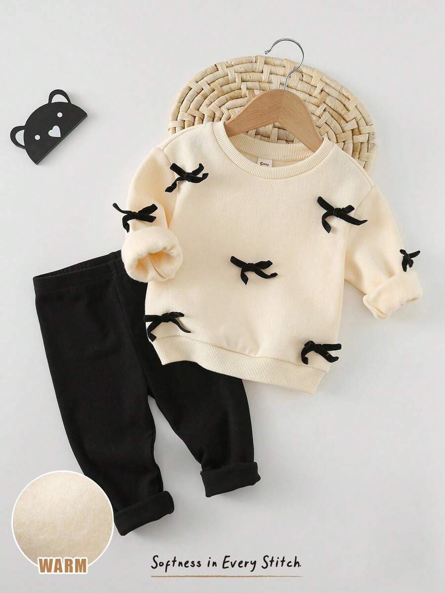 Cozy Pixies 2件套女婴装饰蝴蝶结针织柔软圆领长袖运动衫和松紧腰长裤套装 女婴保暖套装 婴儿休闲套装 女婴冬装 女婴秋冬装套装 婴儿蝴蝶结套装 - 杏色 - 查看 1