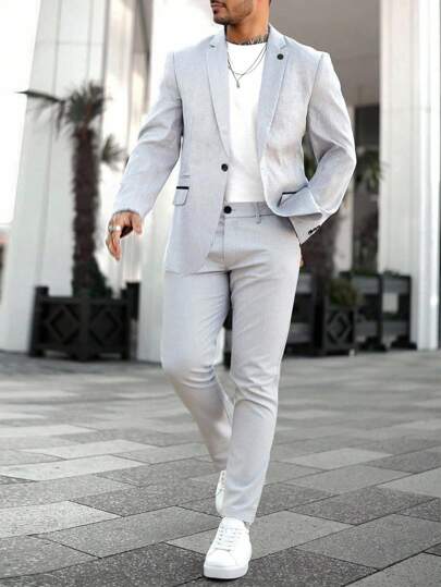 Manfinity Bizformal Conjunto de chaqueta y pantalones de traje casual de negocios para hombres con diseño de solapa entallada que agrega talla grande estilo y versatilidad, adecuado para el uso diario, negocios, fiestas y banquetes. Este conjunto de traje es un artículo versátil e indispensable en el guardarropa de los hombres, y un gran regalo para novios o esposos.