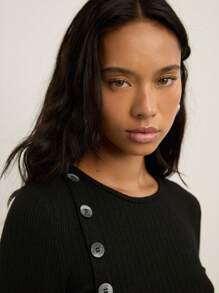 Nöista Ribbed Long-Sleeve Top With An Asymmetric Row Of Statement Buttons Running Down The Side, Designed With A Fitted Silhouette That Adds A Modern And Elegant Touch To Women's Winter Outfits, Perfect For Polished Everyday Looks, Christmas Gatherings And Refined New Year Styling. - Black - View 5