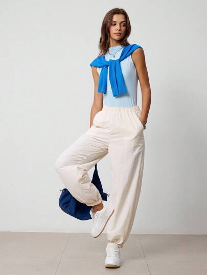 Hanevo Pantalones deportivos de unicolor para mujer con bolsillos laterales y puños en los tobillos, ropa deportiva de otoño para mujeres