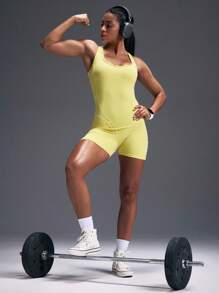 Powerista Damen einfarbiger Criss-Cross Rücken ärmelloser Sport-Romper - Gelb - Übersicht 6