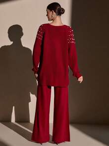 CLARA VERO Completo di maglione in maglia cremosa e pantaloni a gamba ampia