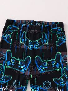 SHEIN Set de pijama suave y cómodo con camiseta de manga larga con cuello redondo y pantalones con estampado de consola de juegos que brilla en la oscuridad para niño preadolescente, 2 piezas - Negro - Ver 4