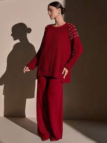 CLARA VERO Completo di maglione in maglia cremosa e pantaloni a gamba ampia