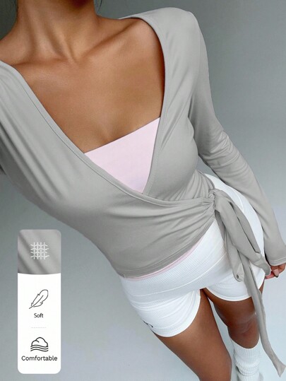 FavEase Camiseta corta de manga larga con cuello en V para mujer, en color rosa, para yoga, fitness y deportes. Diseño elástico, suave y cómodo, de uso casual y elegante, que combina con cualquier atuendo. Prenda esencial de armario para primavera y otoño con un estilo moderno.